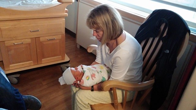 Grandma Lynn talking to baby Ellison.